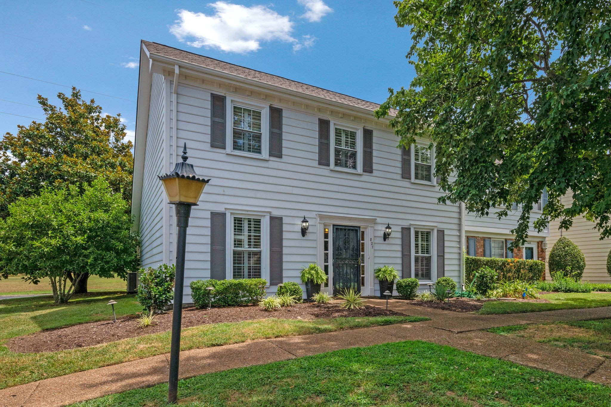 827 General George Patton Road Nashville, TN 37221 - Photo 1 of 26 a front view of a house with yard and green space