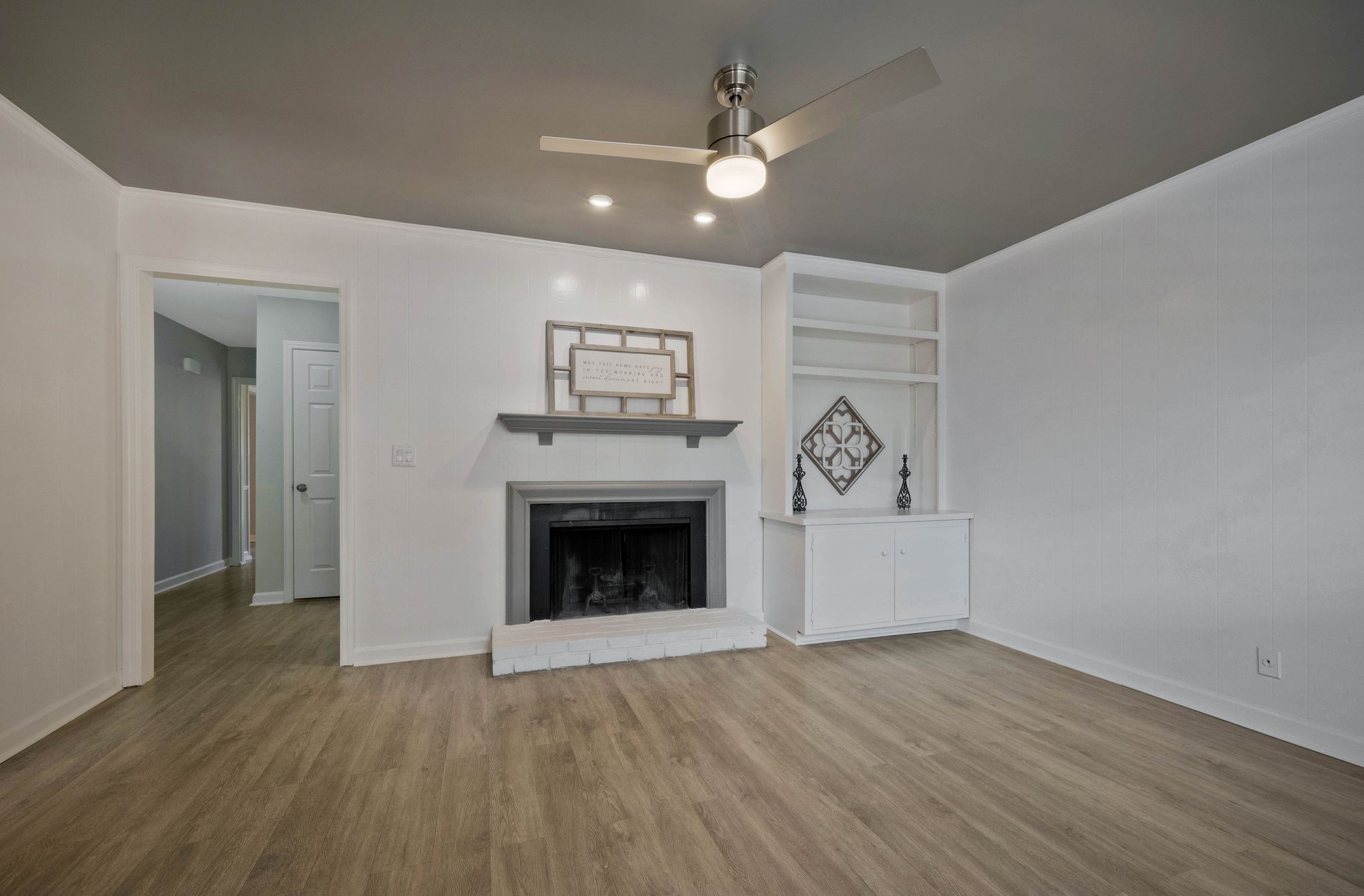 827 General George Patton Road Nashville, TN 37221 - Photo 11 of 26 a view of an empty room with wooden floor and a fireplace