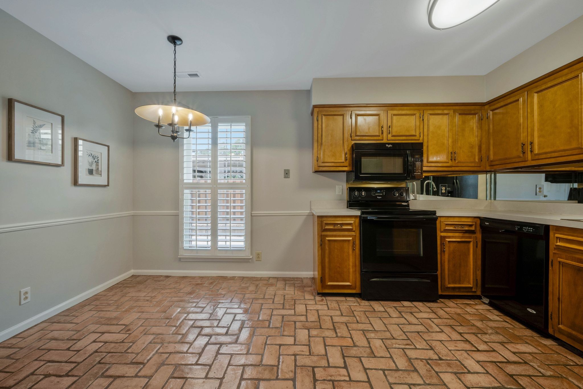 827 General George Patton Road Nashville, TN 37221 - Photo 6 of 26 a kitchen with stainless steel appliances granite countertop a stove sink and microwave