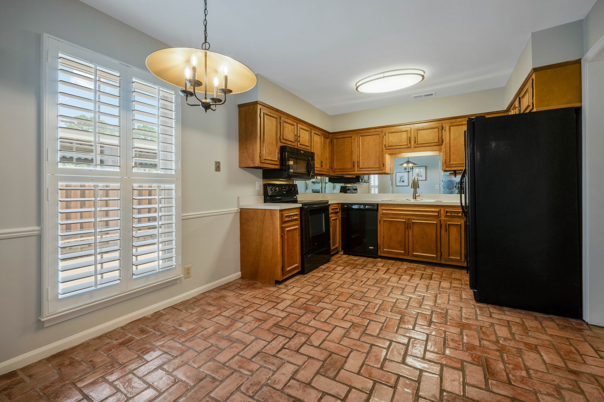 827 General George Patton Road Nashville, TN 37221 - Photo 7 of 26 a kitchen with stainless steel appliances granite countertop a stove top oven a sink dishwasher and a refrigerator