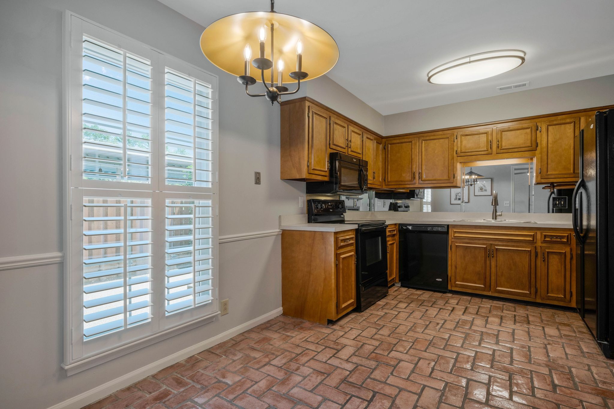 827 General George Patton Road Nashville, TN 37221 - Photo 8 of 26 a kitchen with a refrigerator a sink and a stove
