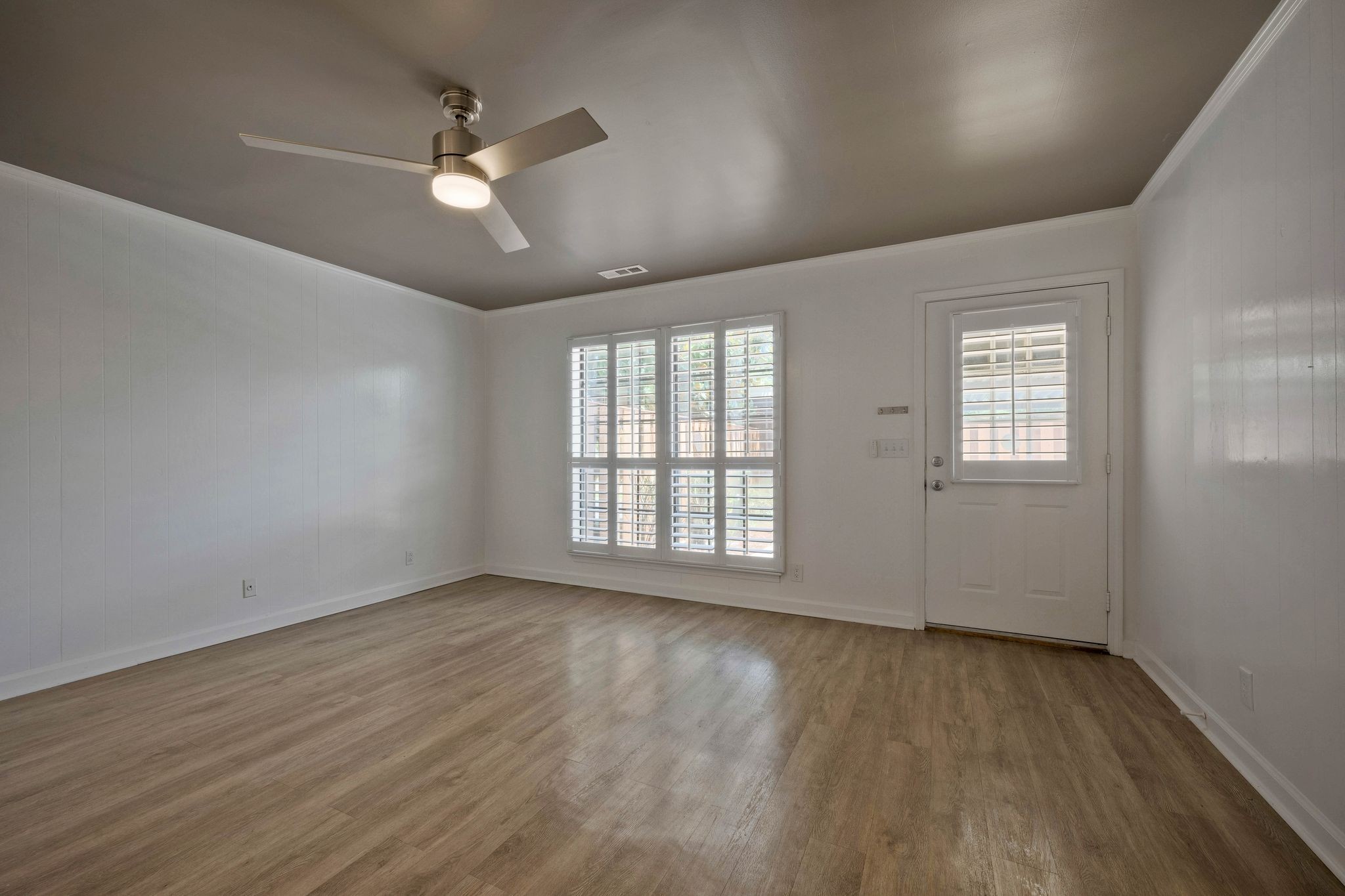 827 General George Patton Road Nashville, TN 37221 - Photo 10 of 26 an empty room with wooden floor and windows