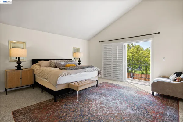 a bedroom with a bed and a couch