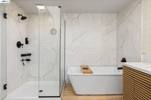 a bathroom with a bathtub and a shower