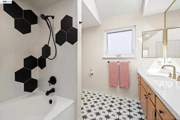 a bathroom with a sink and a bathtub
