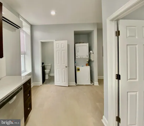 a bathroom with a toilet and a mirror