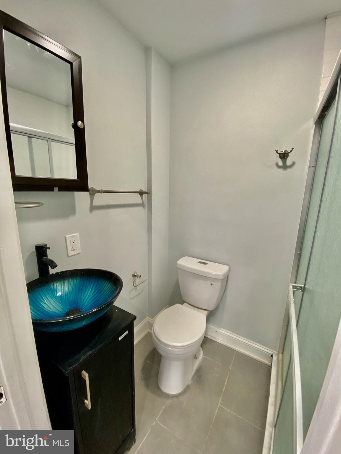 1247 Snyder Avenue Philadelphia, PA 19148 - Photo 13 of 28 a bathroom with a toilet and a mirror