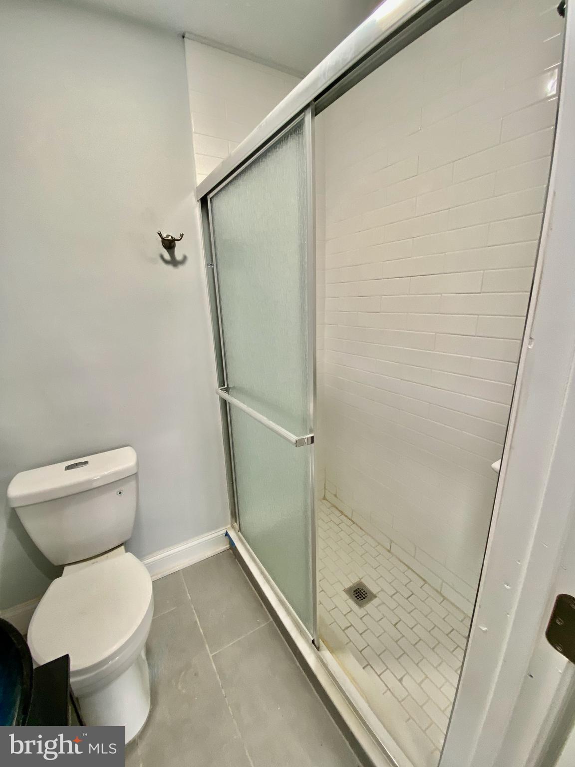 1247 Snyder Avenue Philadelphia, PA 19148 - Photo 14 of 28 a bathroom with a toilet and a shower