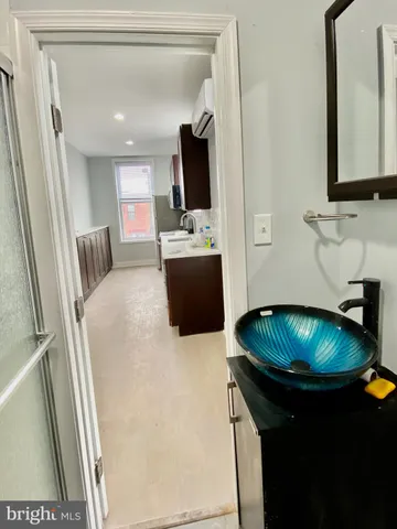 a kitchen with a sink cabinets and window