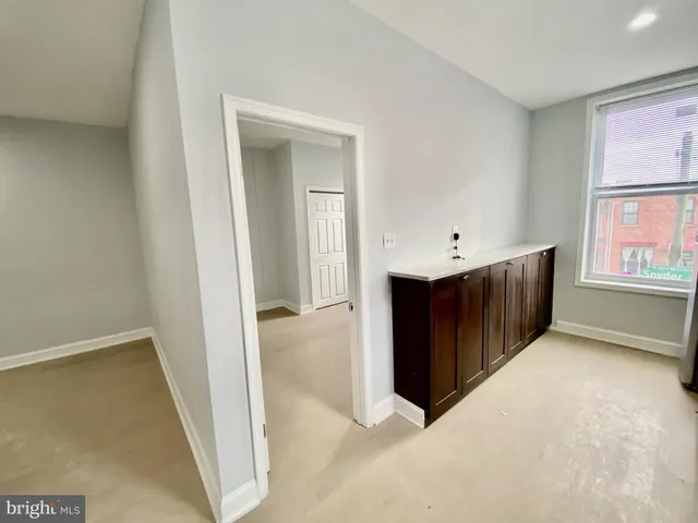 a view of an empty room with a window