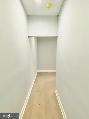 an empty room with a mirror