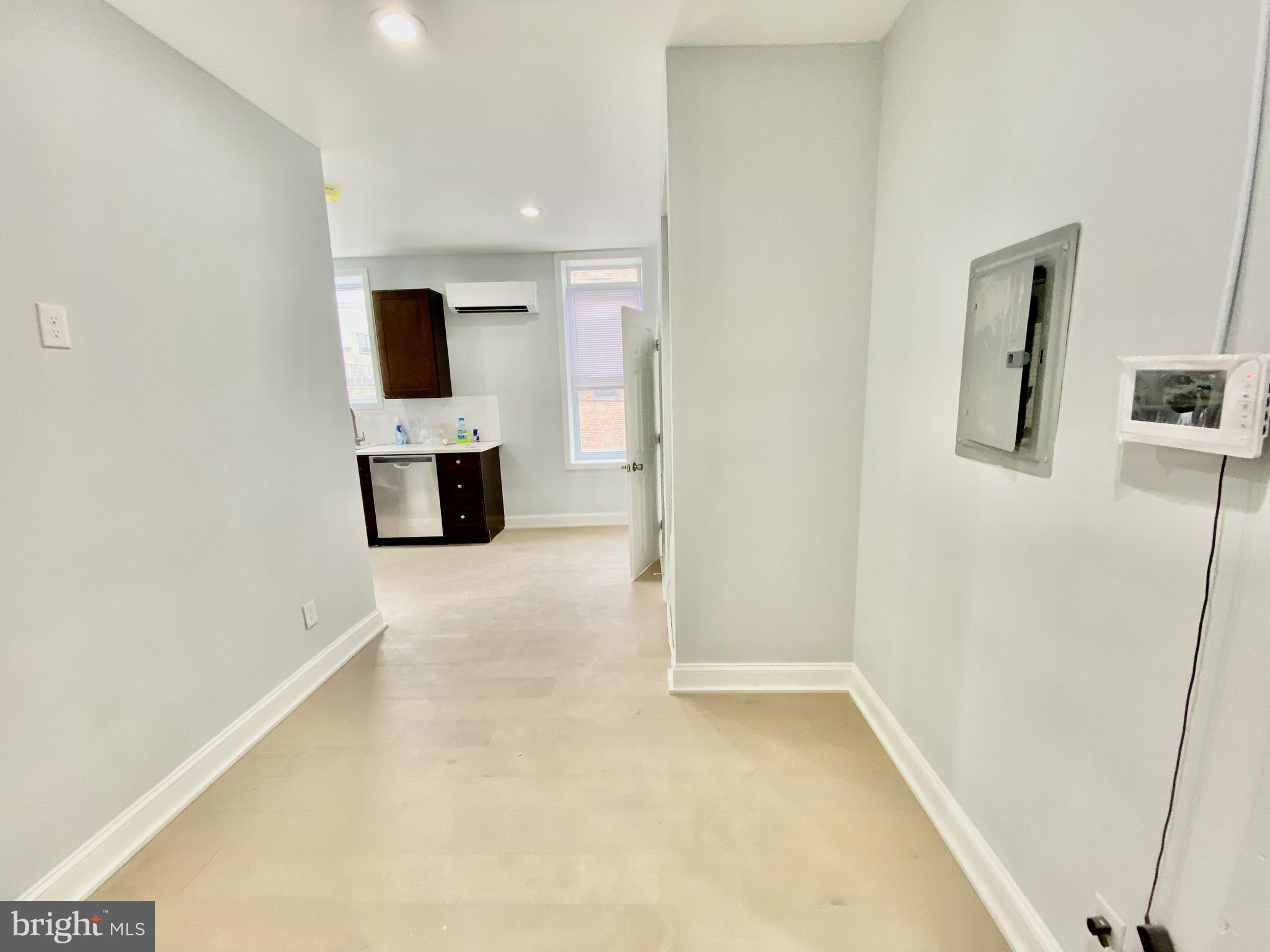 1247 Snyder Avenue Philadelphia, PA 19148 - Photo 8 of 28 a view of a hallway with a kitchen