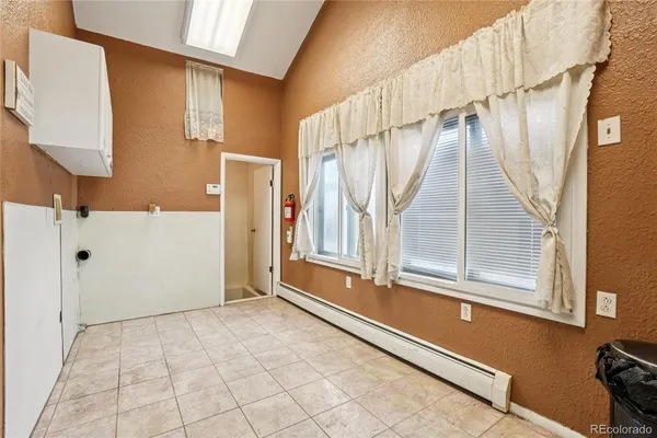 a view of a door and a window