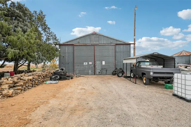a view of a house with a yard and garage