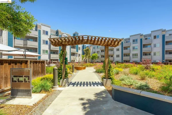 a kitchen with stainless steel appliances a refrigerator sink and stove