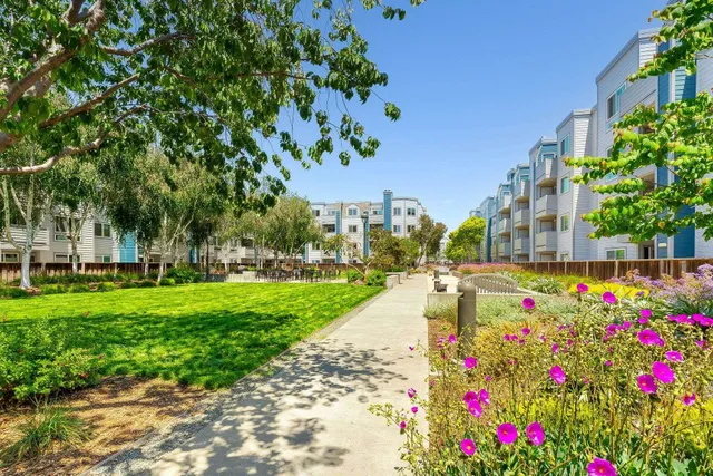 a view of yard with swimming pool and green space