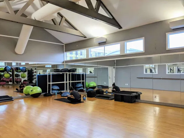 a room with gym equipment and a large window