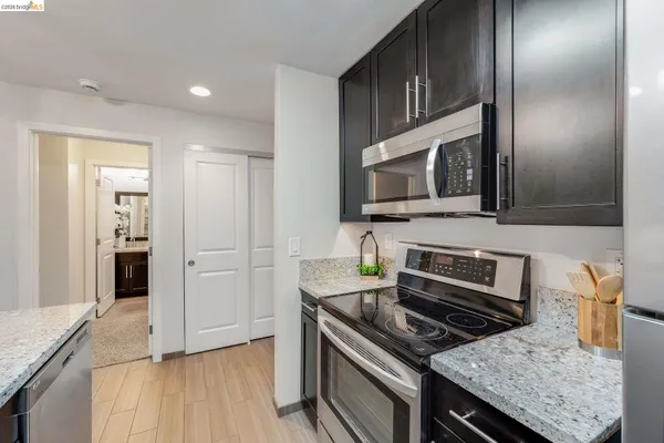 a kitchen with a refrigerator sink and microwave
