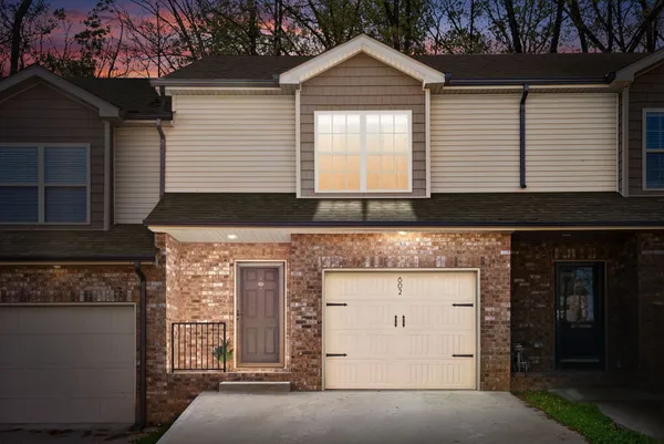 a front view of a house with a garage