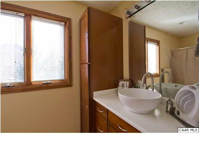 37 Colonial Road Palmyra, VA 22963 - Photo 12 of 22 a bathroom with a sink a mirror and a window