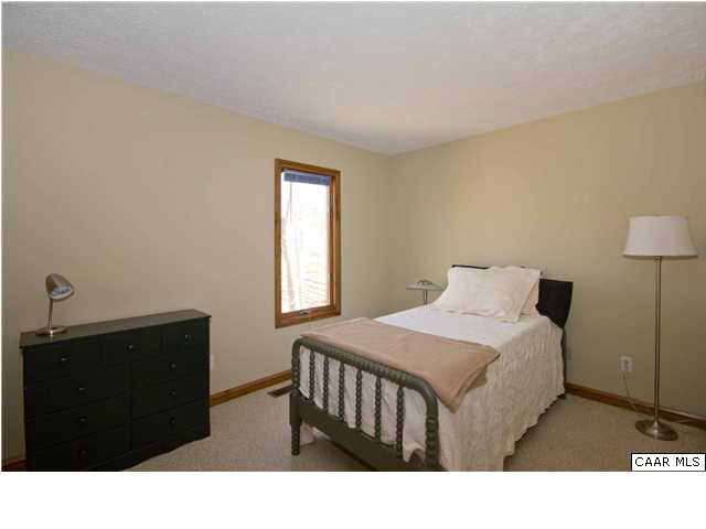 37 Colonial Road Palmyra, VA 22963 - Photo 15 of 22 a bedroom with a bed window and a lamp