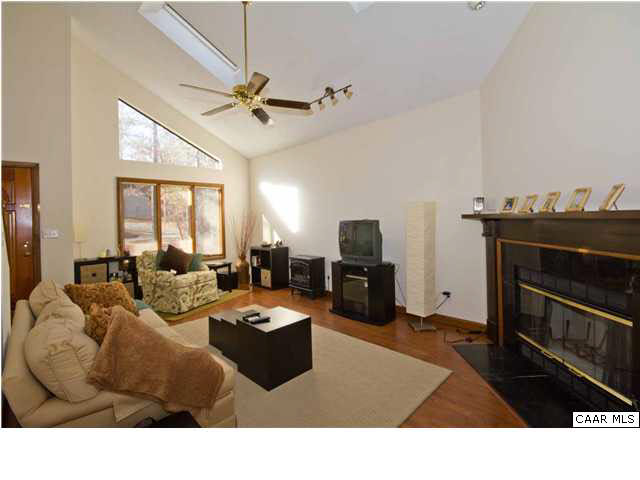 37 Colonial Road Palmyra, VA 22963 - Photo 3 of 22 a living room with furniture a fireplace and a window
