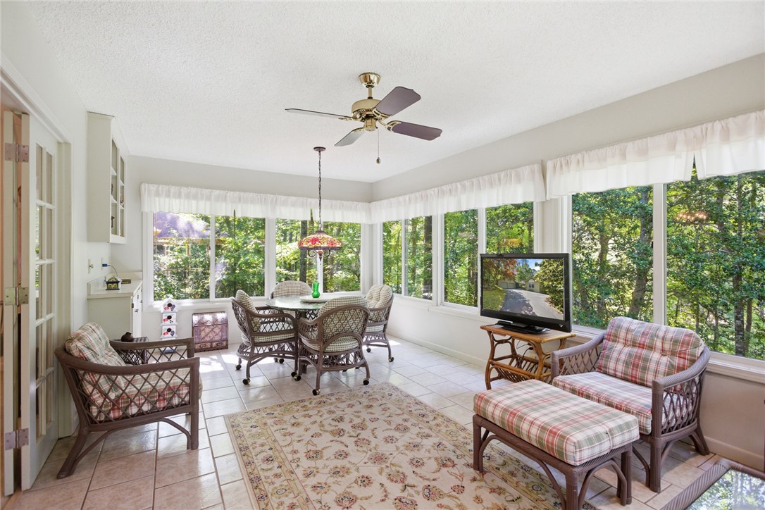 6 Tradewinds Way Salem, SC 29676 - Photo 8 of 50 This bright sunroom offers expansive views, perfect for peaceful relaxation or intimate gatherings.