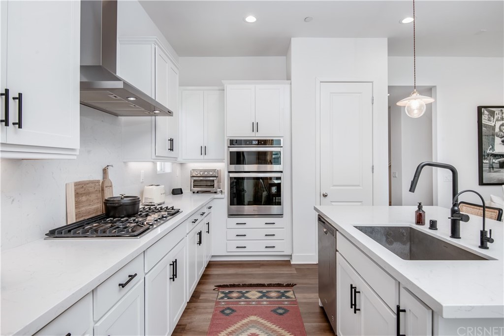 575 Daniel Freeman Circle Inglewood, CA 90301 - Photo 13 of 42 a kitchen with stainless steel appliances a sink stove and refrigerator