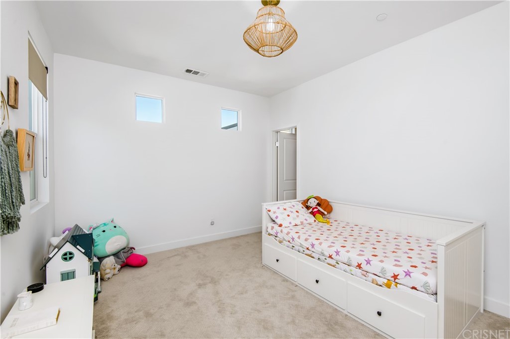 575 Daniel Freeman Circle Inglewood, CA 90301 - Photo 27 of 42 a white bed sitting in a bedroom next to a window