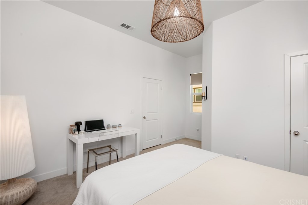 575 Daniel Freeman Circle Inglewood, CA 90301 - Photo 32 of 42 a bedroom with a bed and a table