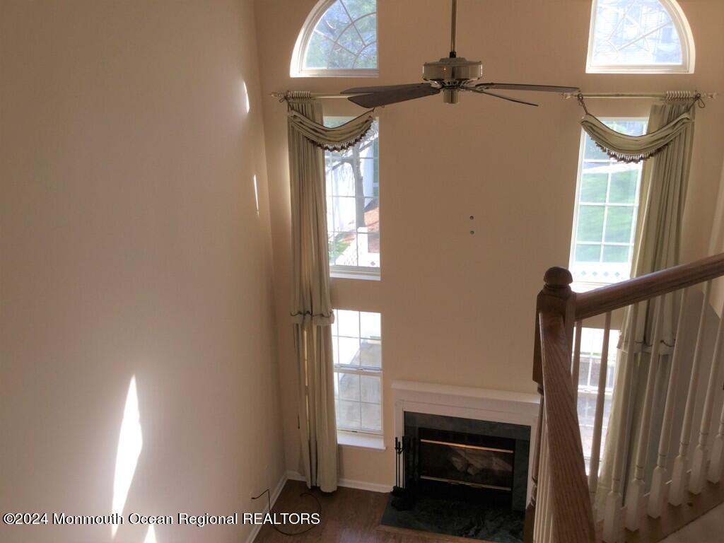 5 Oxford Road Holmdel, NJ 07733 - Photo 14 of 16 a view of a livingroom with a window and a fireplace