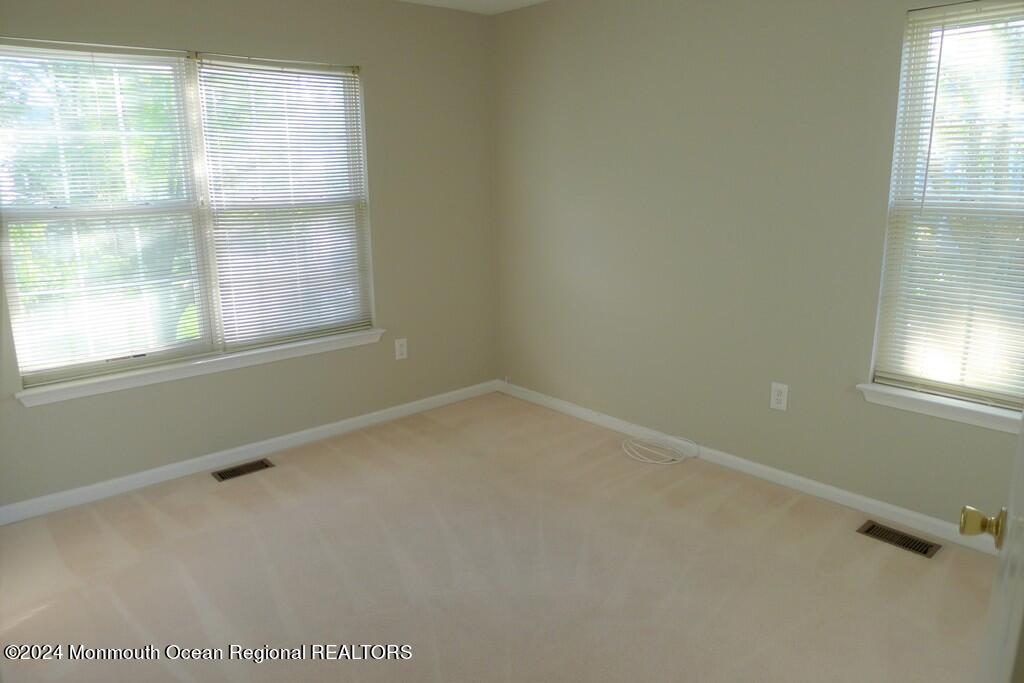 5 Oxford Road Holmdel, NJ 07733 - Photo 4 of 16 an empty room with a window