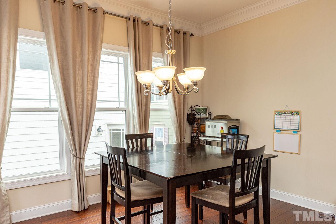 1536 Rodessa Run Raleigh, NC 27607 - Photo 14 of 53 a view of a dining room with furniture and a window