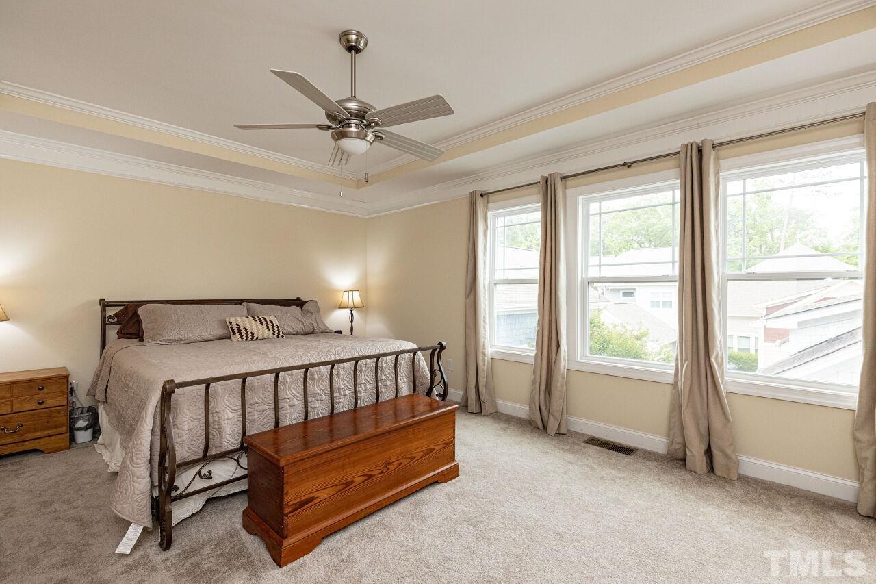 1536 Rodessa Run Raleigh, NC 27607 - Photo 19 of 53 a bed sitting in a bedroom next to a window
