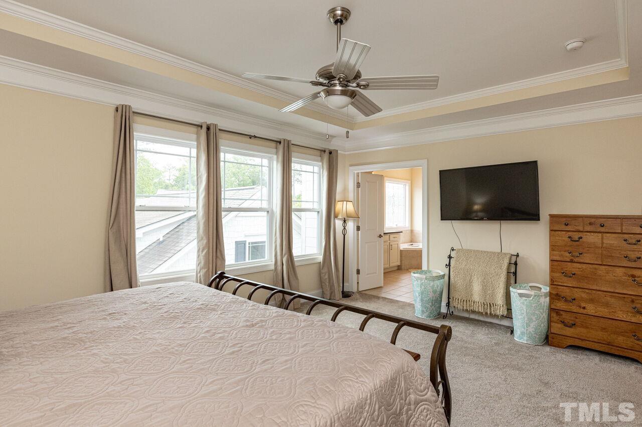 1536 Rodessa Run Raleigh, NC 27607 - Photo 20 of 53 a bedroom with furniture and a flat screen tv
