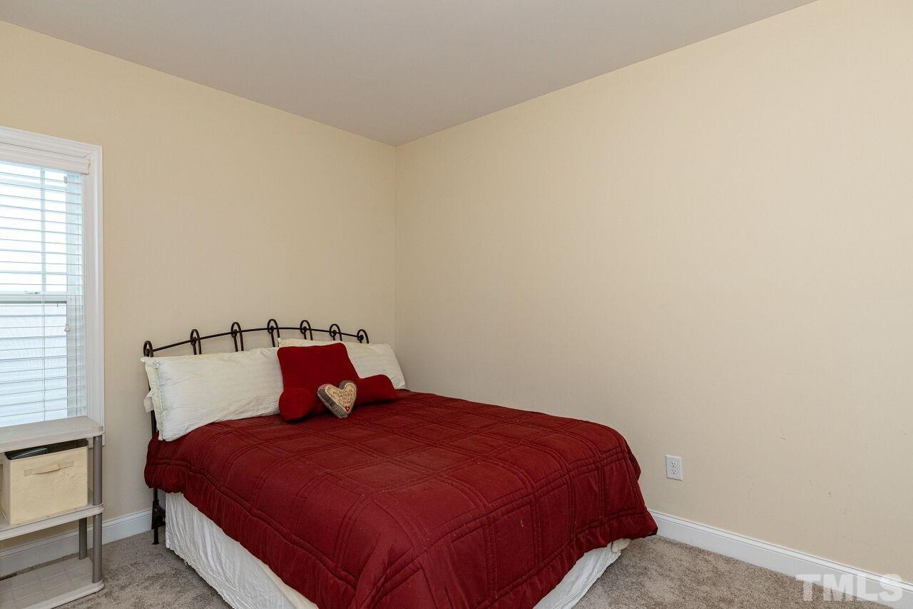 1536 Rodessa Run Raleigh, NC 27607 - Photo 25 of 53 a bedroom with a bed and window