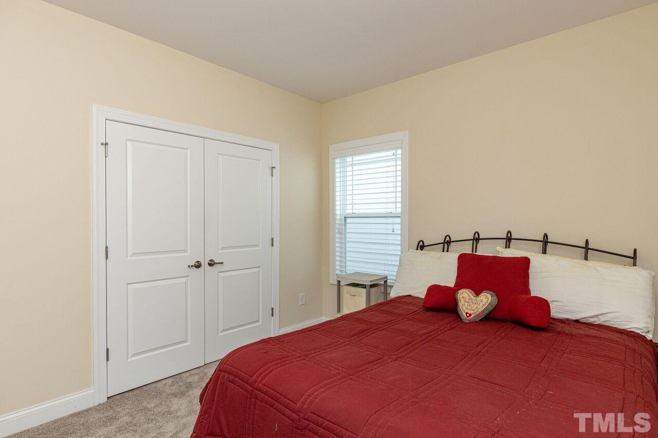 1536 Rodessa Run Raleigh, NC 27607 - Photo 26 of 53 a bedroom with a bed and window