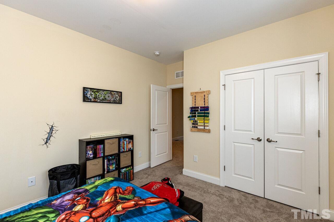 1536 Rodessa Run Raleigh, NC 27607 - Photo 31 of 53 a bedroom with a bed and a closet