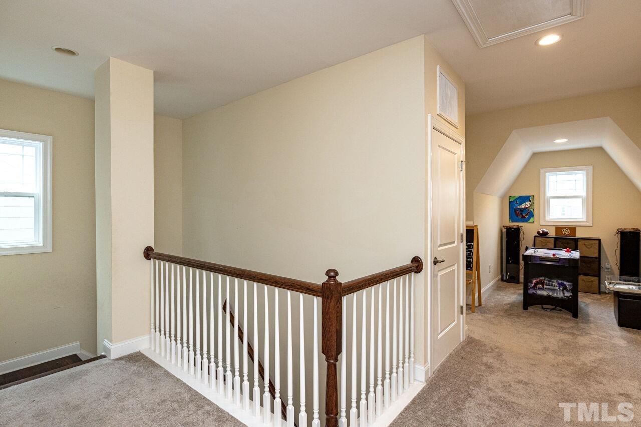 1536 Rodessa Run Raleigh, NC 27607 - Photo 32 of 53 a view of a hallway to a livingroom with furniture