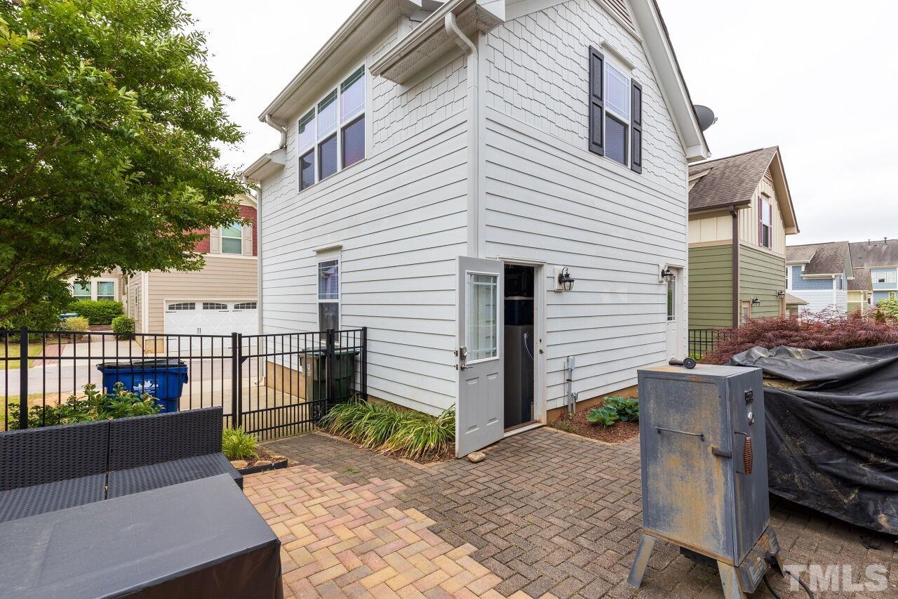 1536 Rodessa Run Raleigh, NC 27607 - Photo 36 of 53 a view of a patio with a table and chairs