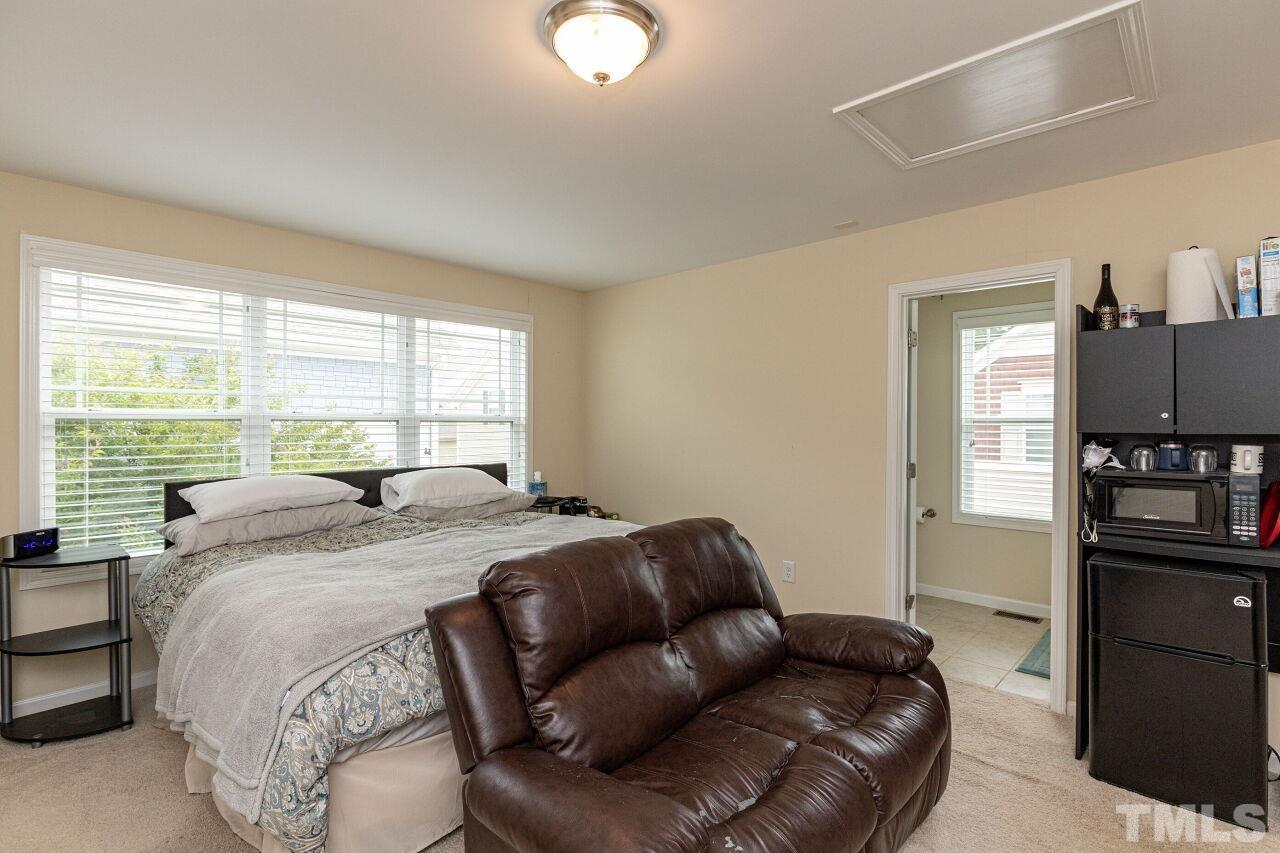 1536 Rodessa Run Raleigh, NC 27607 - Photo 38 of 53 a bedroom with a bed window and a television