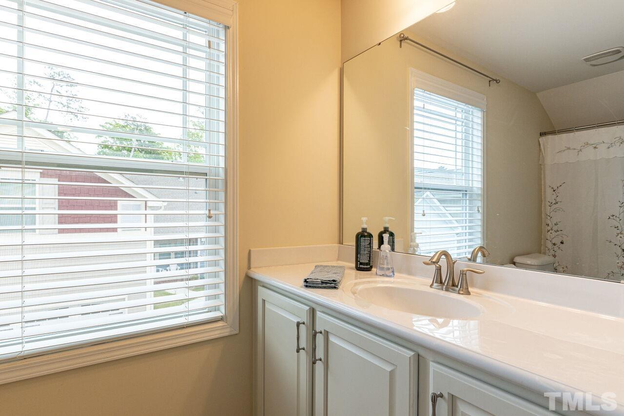 1536 Rodessa Run Raleigh, NC 27607 - Photo 39 of 53 a bathroom with a sink and a window