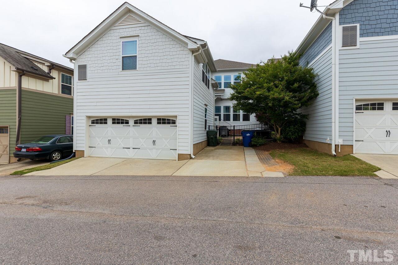 1536 Rodessa Run Raleigh, NC 27607 - Photo 41 of 53 a view of a house with a yard and garage