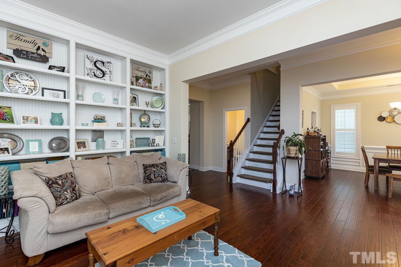 1536 Rodessa Run Raleigh, NC 27607 - Photo 7 of 53 a living room with furniture and a wooden floor