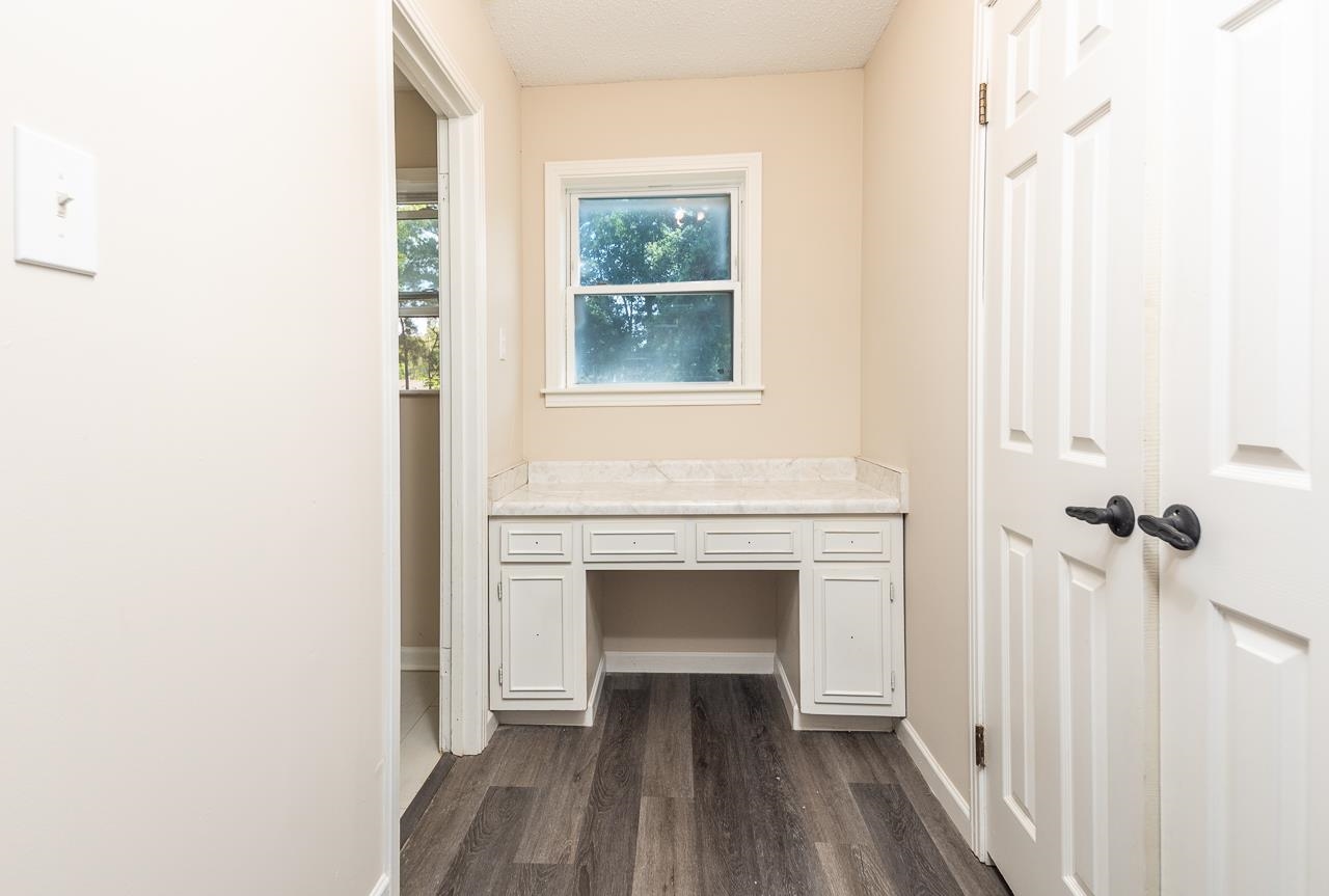 2718 Kate Bond Road Memphis, TN 38133 - Photo 24 of 39 Doorway to outside featuring wood finished floors and built in desk
