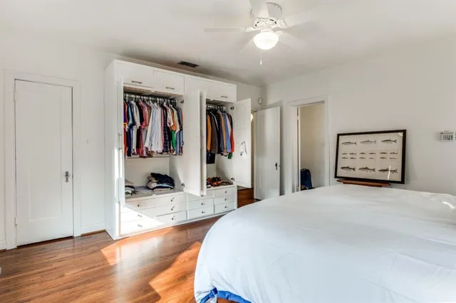 a bedroom with a bed and a walk in closet