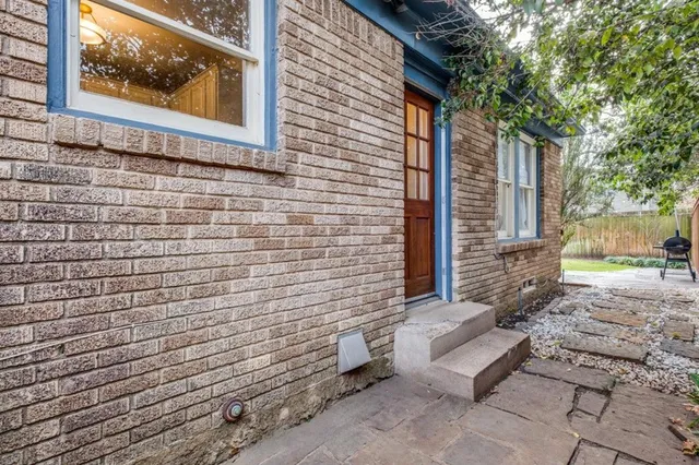 a view of a brick house with a door