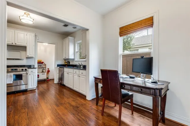 a kitchen with a workspace and a stove top oven