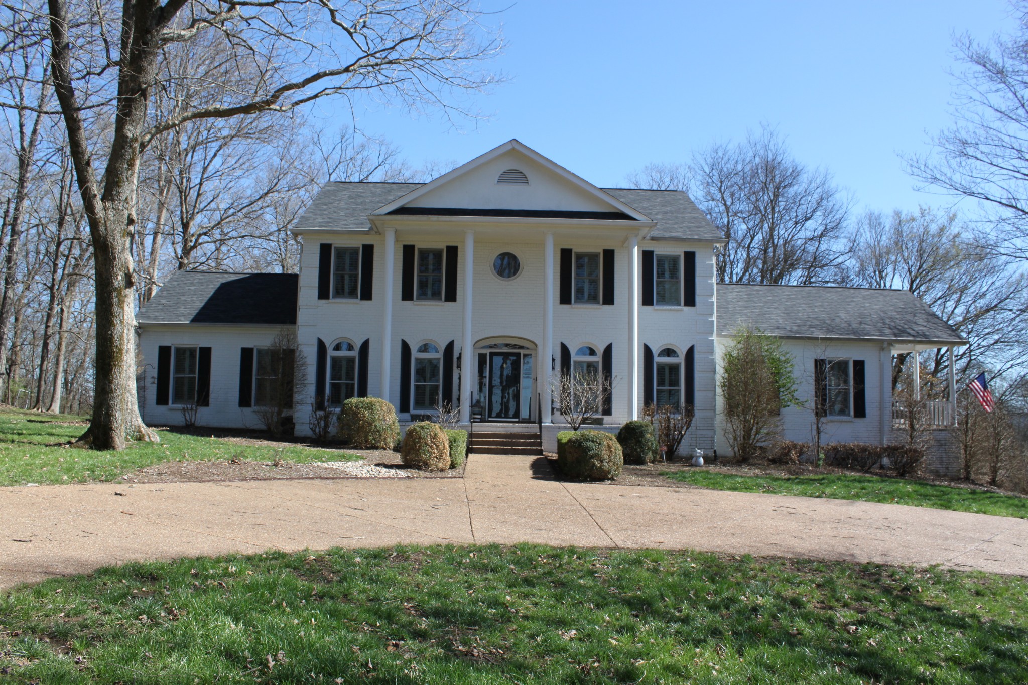 a front view of a house with a yard