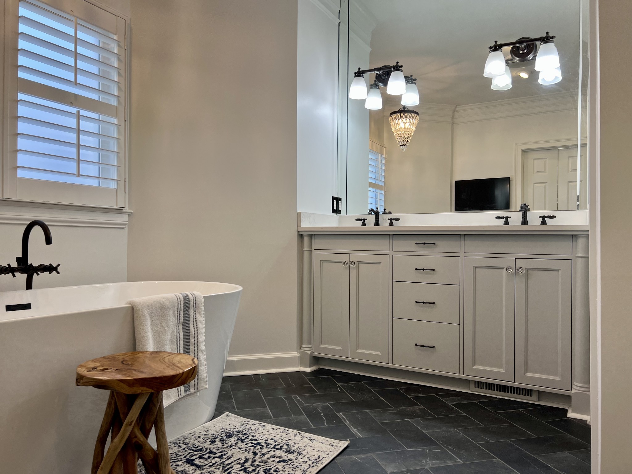 4264 Warren Road Franklin, TN 37067 - Photo 17 of 49 a spacious bathroom with a granite countertop sink a toilet and a mirror